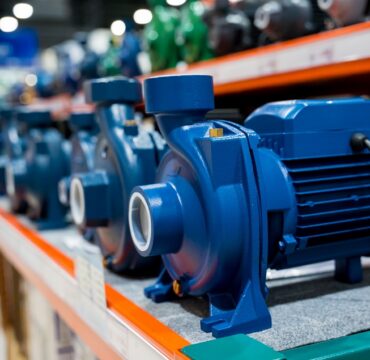 Industrial water pump with electric motor for community on a store shelf Industrial water pump with electric motor for community on a store shelf.